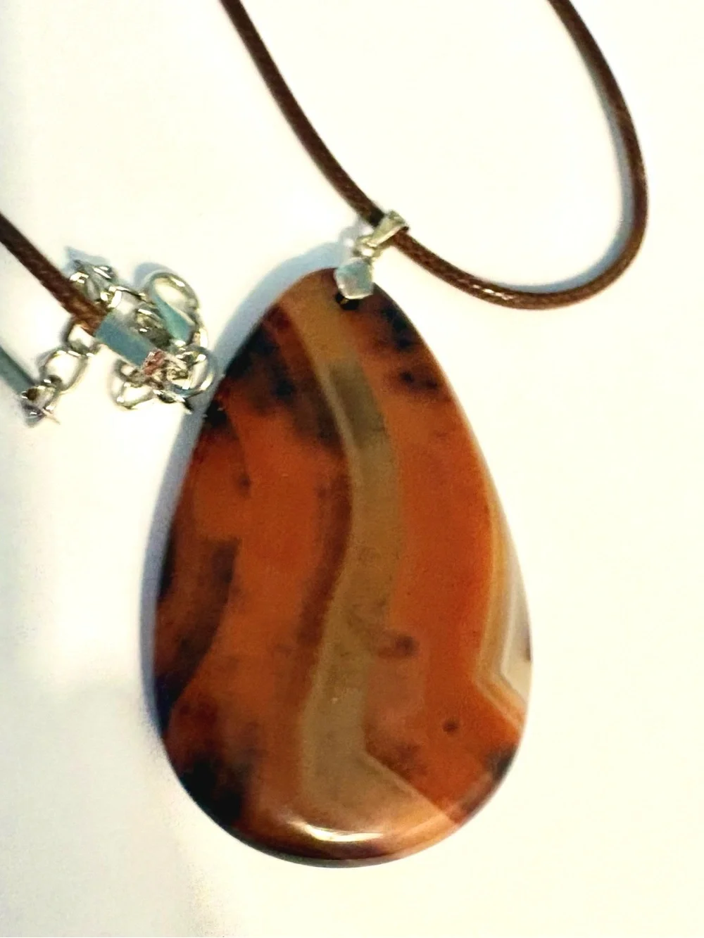 Beautiful, Geode Agate, pendant on a brown leather cord.